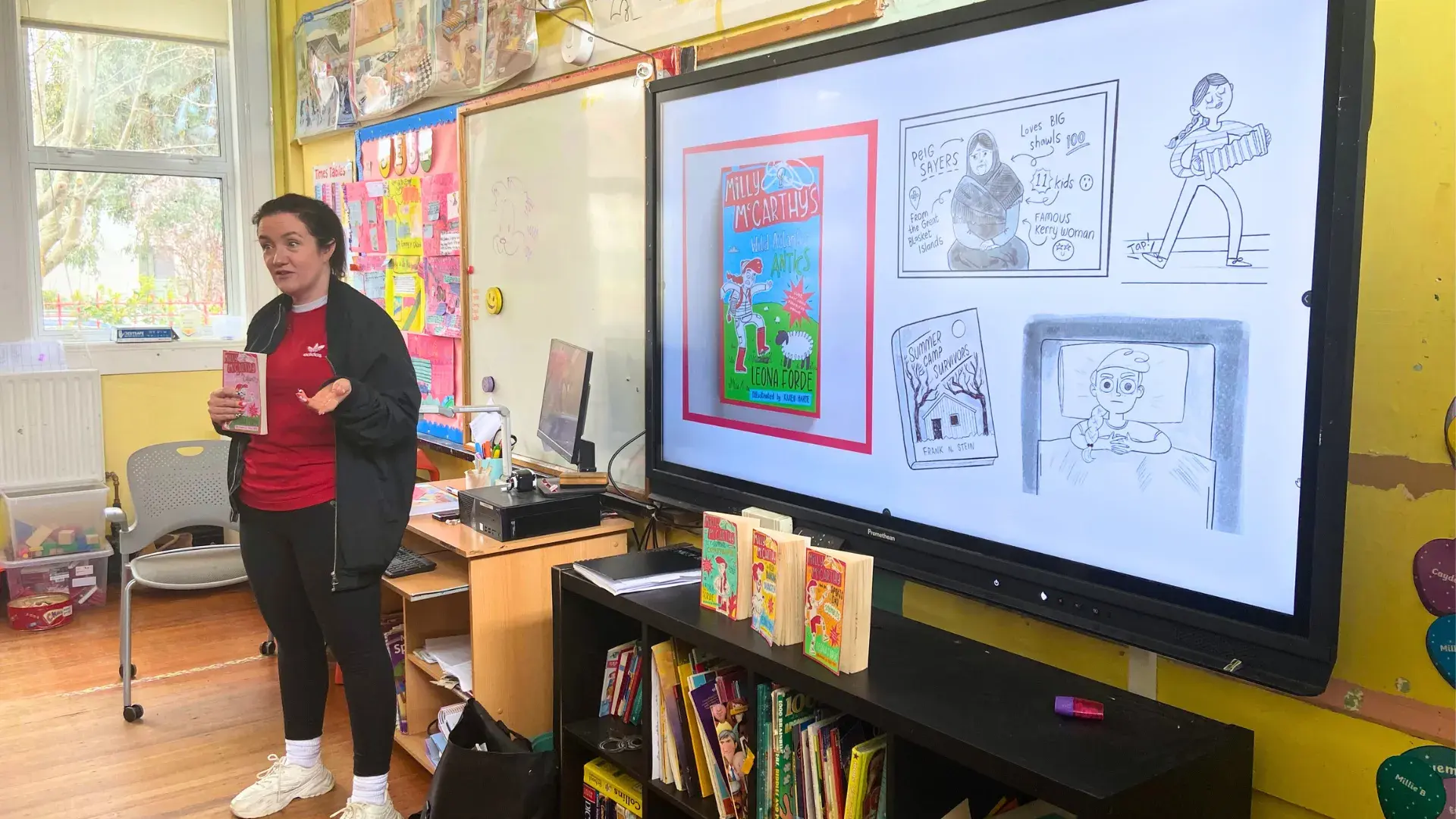 A children's book author giving a presentation in a school classroom