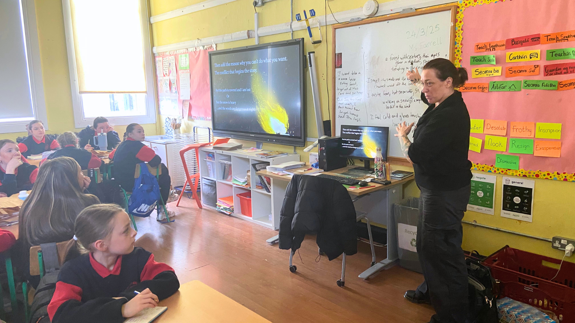 A children's book author giving a presentation in a school classroom