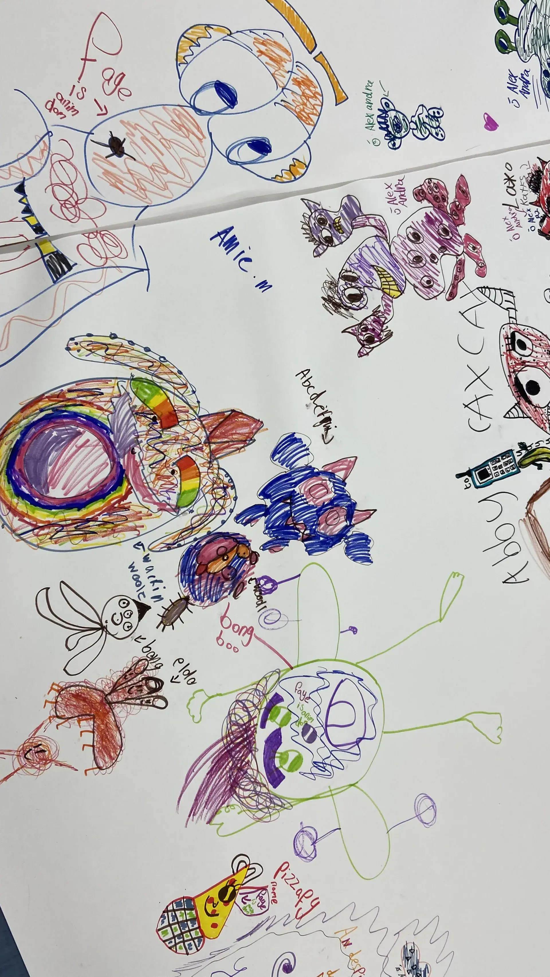 Large sheet filled with vibrant hand-drawn characters and doodles in various colors.