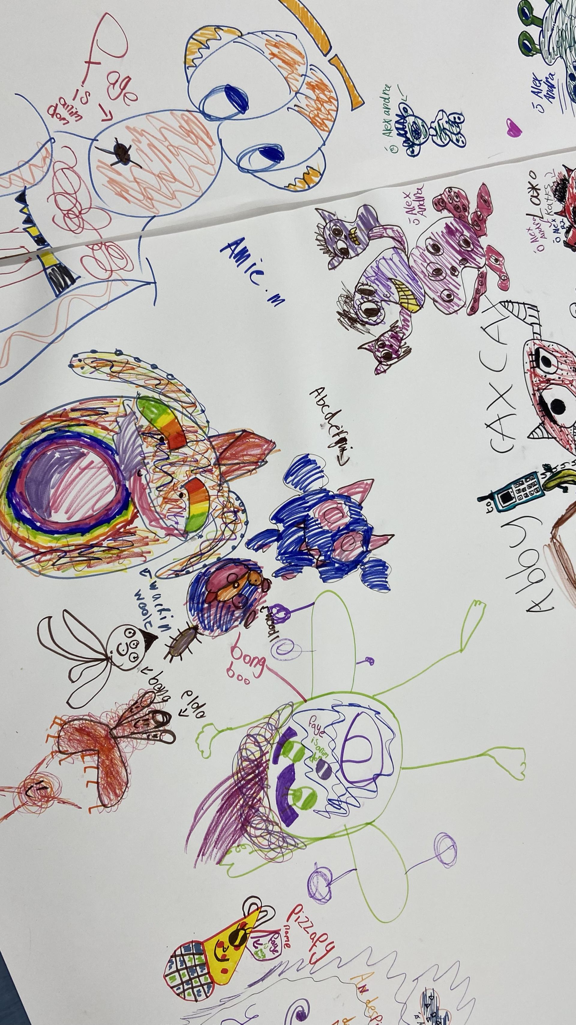 Large sheet filled with vibrant hand-drawn characters and doodles in various colors.