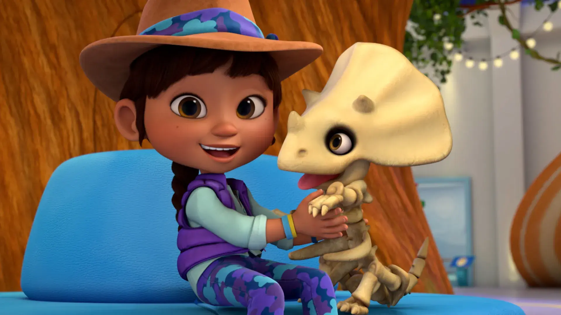 Ridley Jones with a baby triceratops skeleton