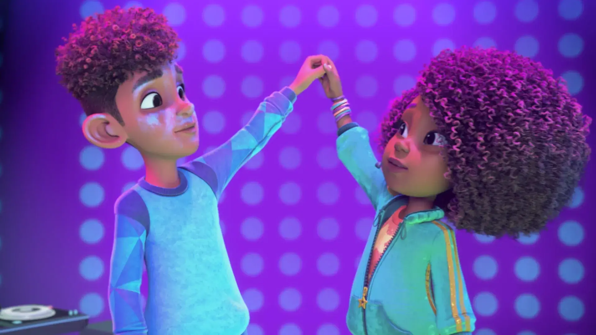 Karma and Winston holding hands up high.