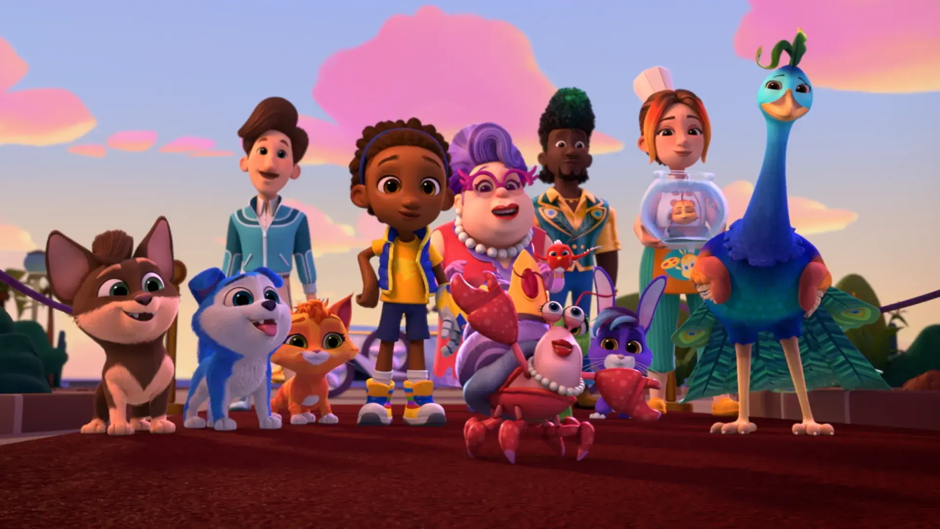 Animated group shot from RoboGobo showing the full team of animal heroes and their human friends standing together on a path at sunset. The lineup includes dogs, cats, a rabbit, a crab, and a tall peacock‑like bird, all posed confidently against a warm pink-and-gold sky, conveying teamwork and adventure.