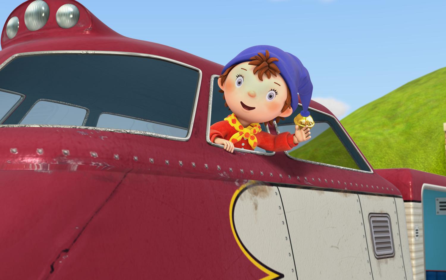 Noddy with his head out the window of a train