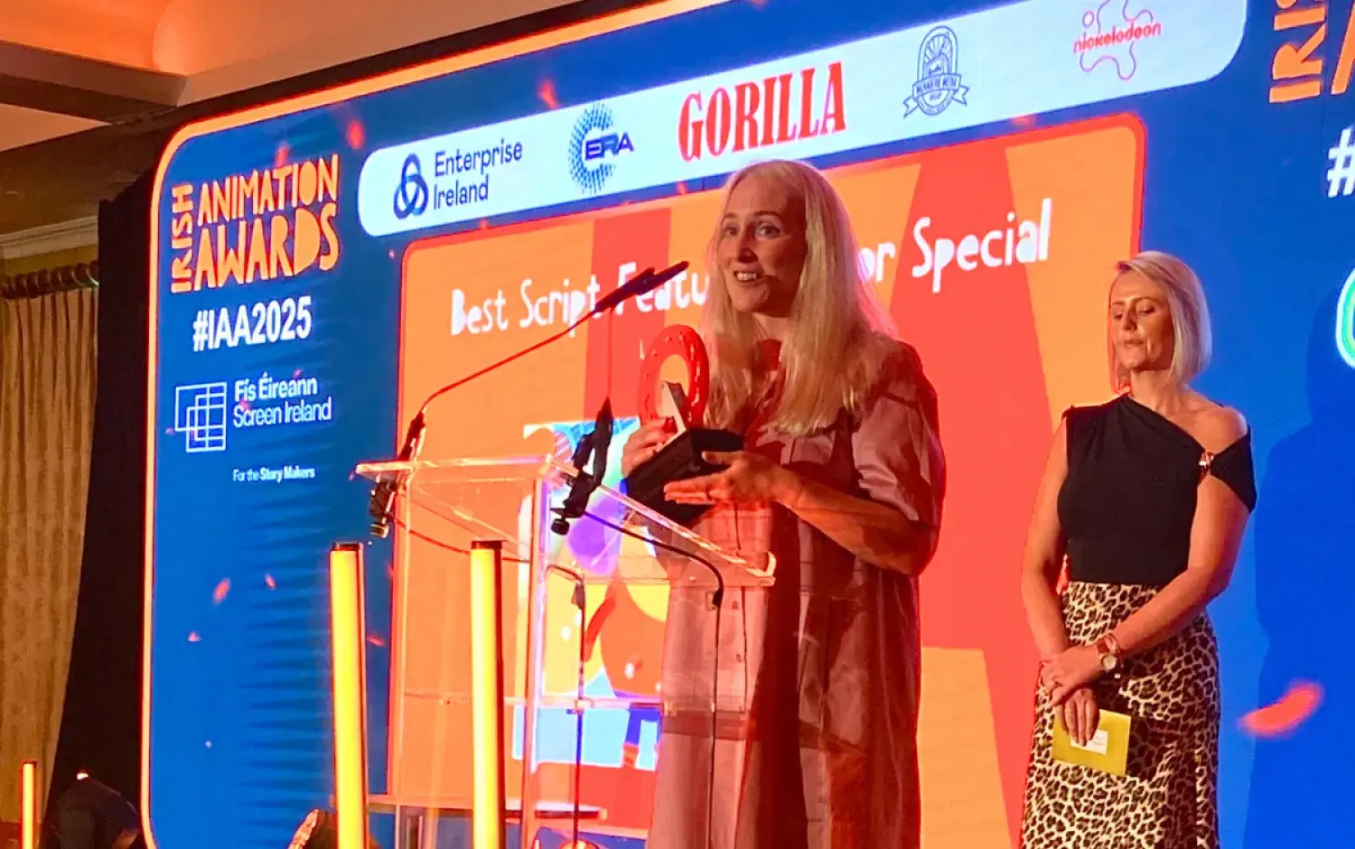 Irish Animation Awards 2025 Awards staff members with trophy on stage