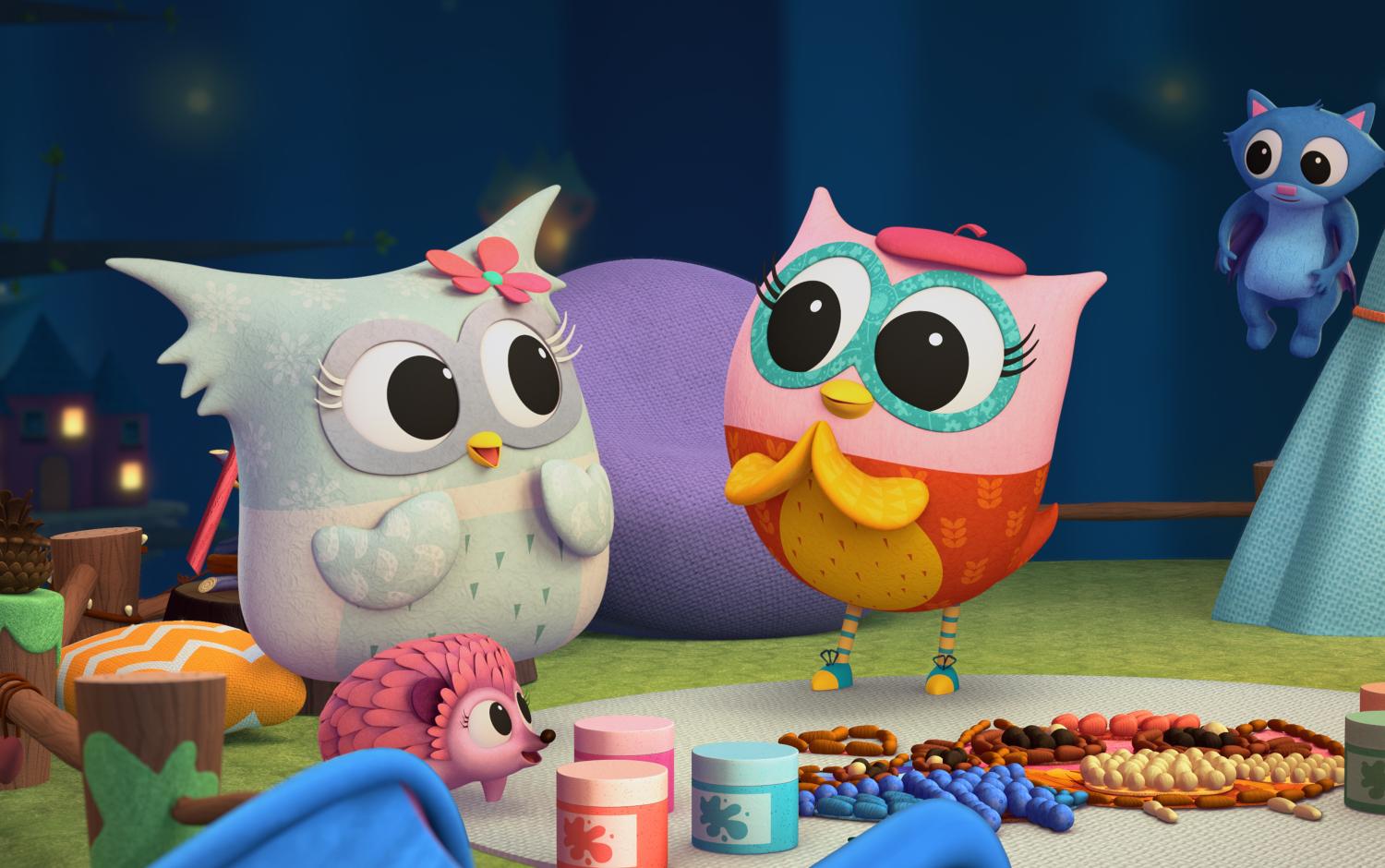 Two owlets looking pleased