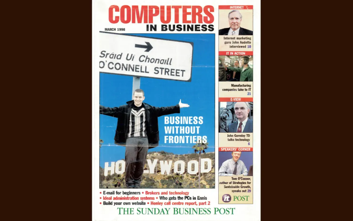 Magazine cover titled Computers in Business featuring a person holding a street sign in front of a Hollywood backdrop, with headlines and smaller images along the side.