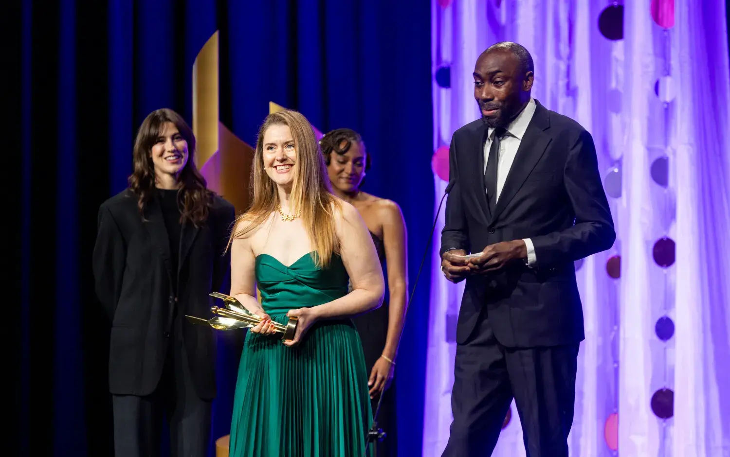 Xavier Riddle writers, Meghan Read and Desmond Sargeant accepting awards