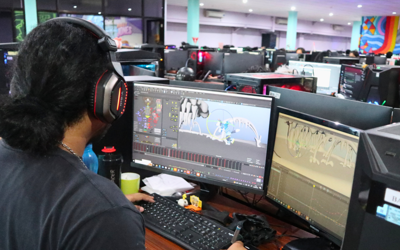 A photo of our studio location in Brown Bag Films Bali featuring people working on animation wearing headphones