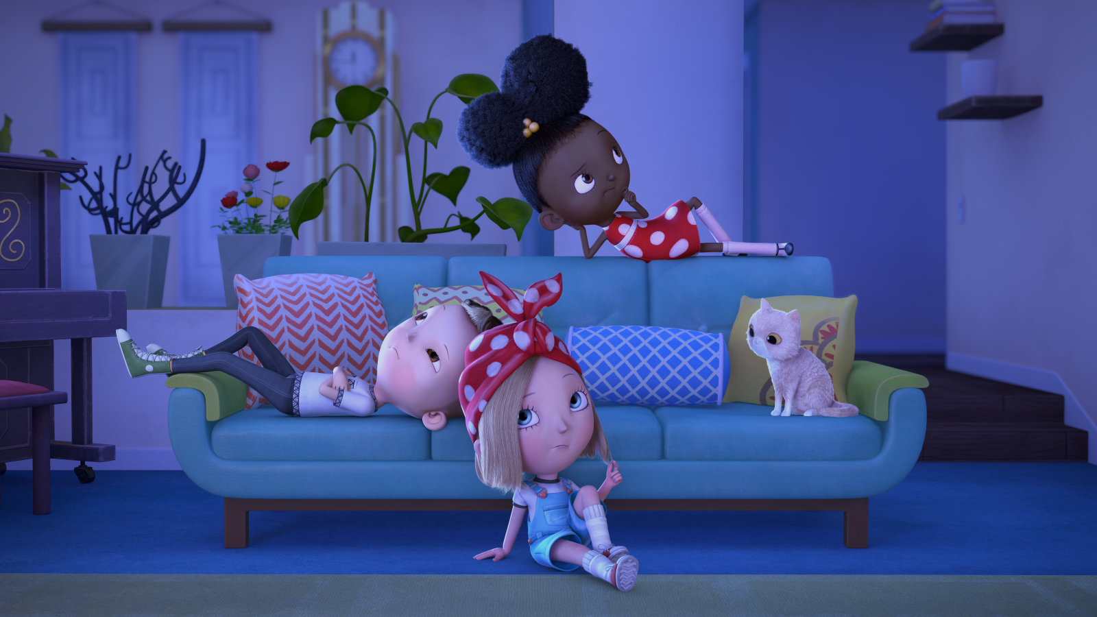 Ada, Iggy and Rosie lounging beside the couch in the sitting room in the dark