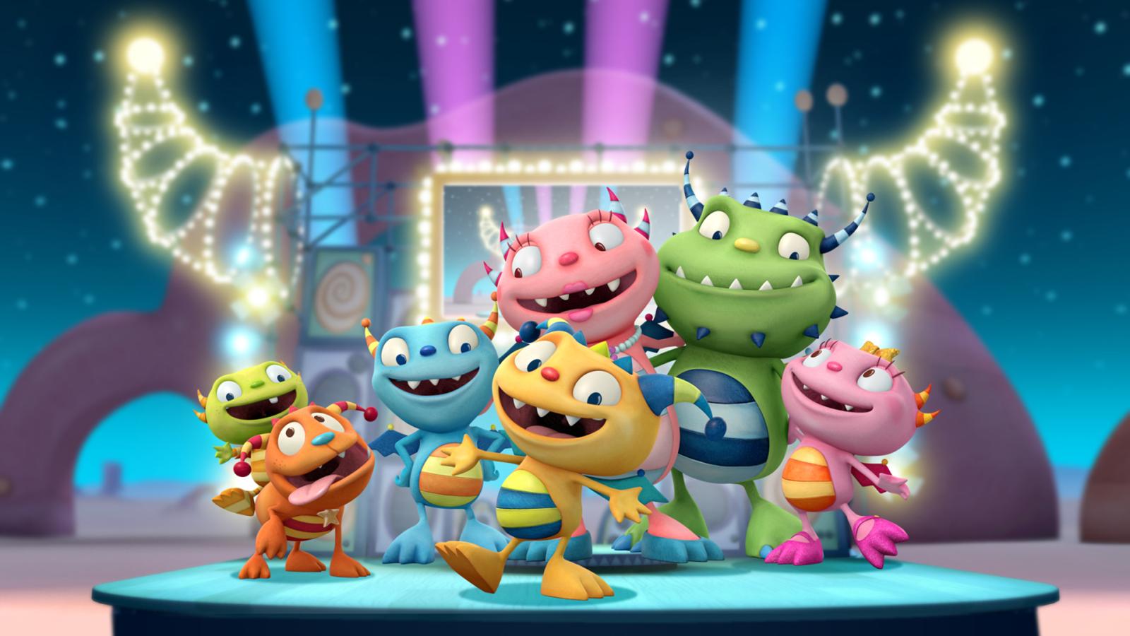 Henry and his family on a brightly lit stage