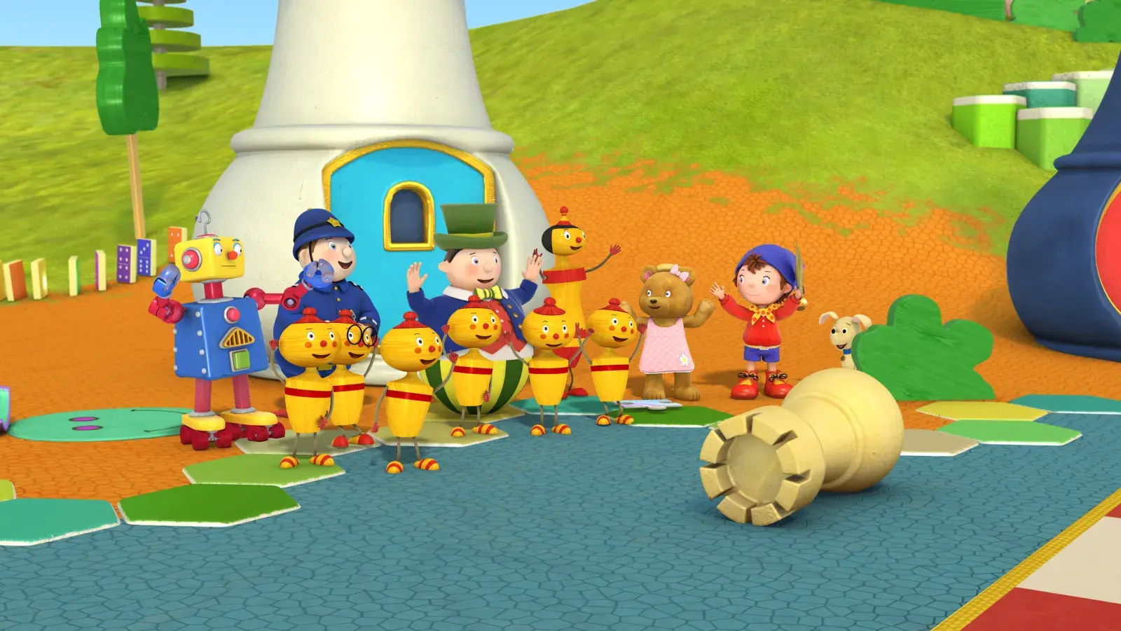 Noddy and friends standing around together looking at a large chess piece that is laying on the ground