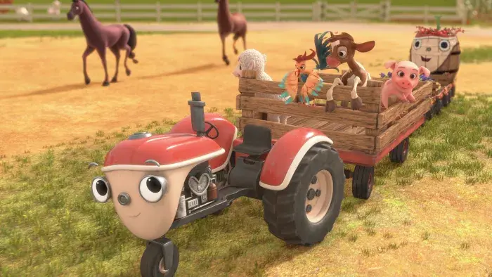 Otis on the farm pulling a trailer filled with animals