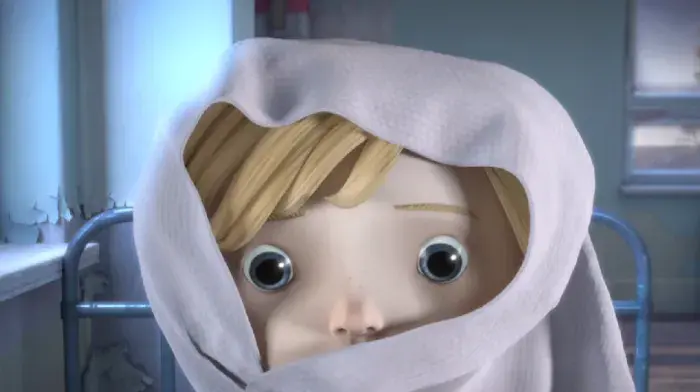 Close-up of Anya in a hooded garment, looking straight ahead.