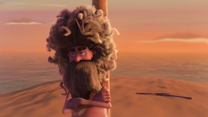 A still from the short film An Ode to Love, showing a man deserted on a beach with a stick