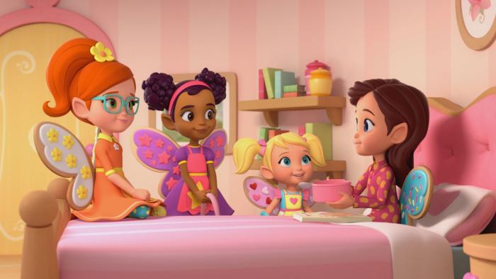 Butterbean in her bedroom sitting up in bed with her friends around her