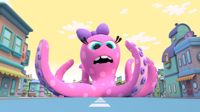 A large pink octopus wearing a purple bow on the road in Blunderburg