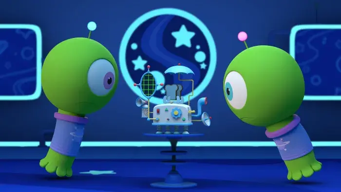 Two green aliens inside a spaceship