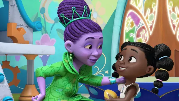 Dee and Miss Emerald, the teacher at the Wonderful School of Oz smiling at each other