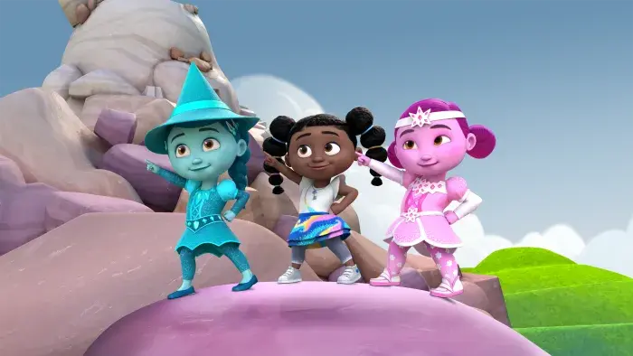 Dee with Eastyn and Westyn standing on top of a boulder