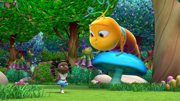 Dee standing near a large caterpillar on top of a blue mushroom