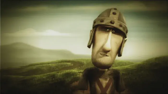 Close-up of a man wearing a helmet, looking serious.