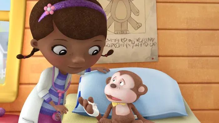 Doc McStuffins bandaging a monkey toy