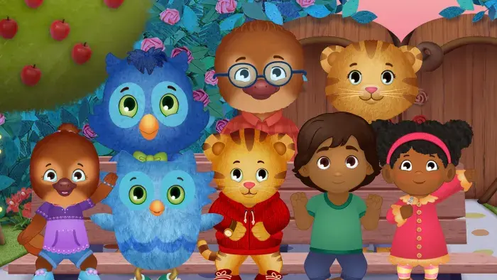 Daniel Tiger's Neighborhood: Group photo with Daniel, friends, and owl characters by a tree.