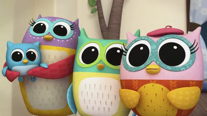 a group of owls including Eva the Owlet standing together