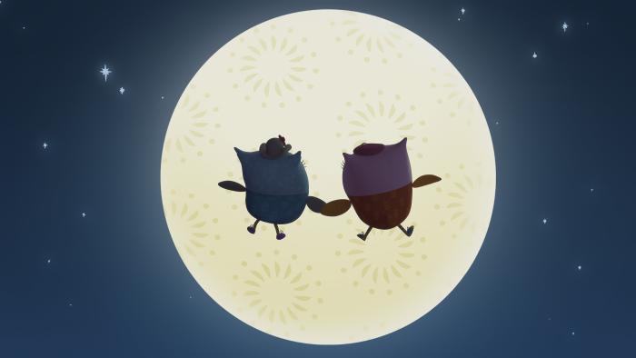 Two owls in front of a full moon