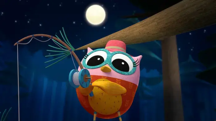 Eva the Owlet holding a fishing reel