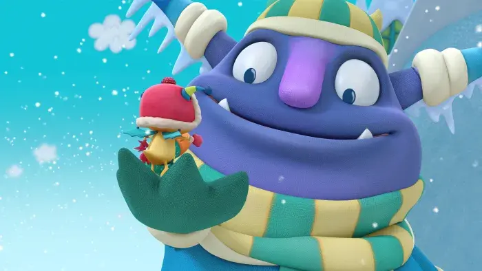 A giant friendly monster holding Henry in his palm