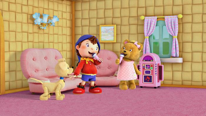 Noddy and a bear toy character in a pink check dress, singing holding pink microphones