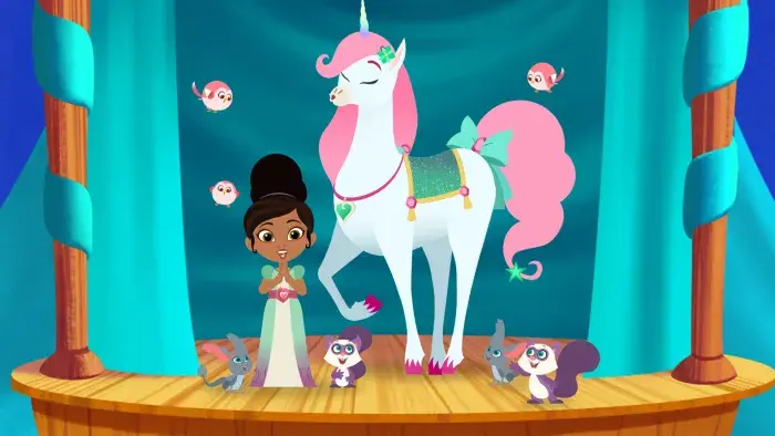 Nella the Princess Knight and her unicorn on a stage