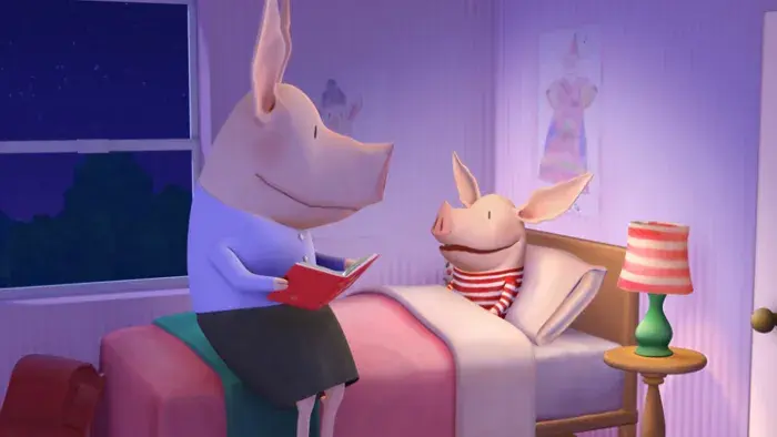 Olivia in her bed with her mother reading her a book.