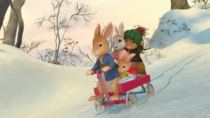 Peter, Lily and Benjamin in a cart rolling through the snow