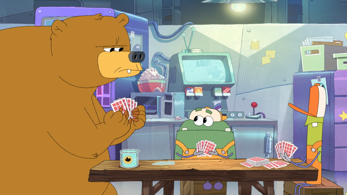 StoryBots: Answer Time: A bear and another character sit at a table in a lab or office.
