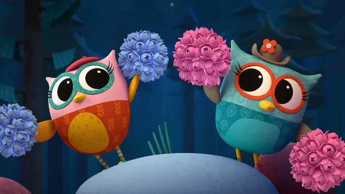 Two owlets with pom-poms in a cheerleading pose.